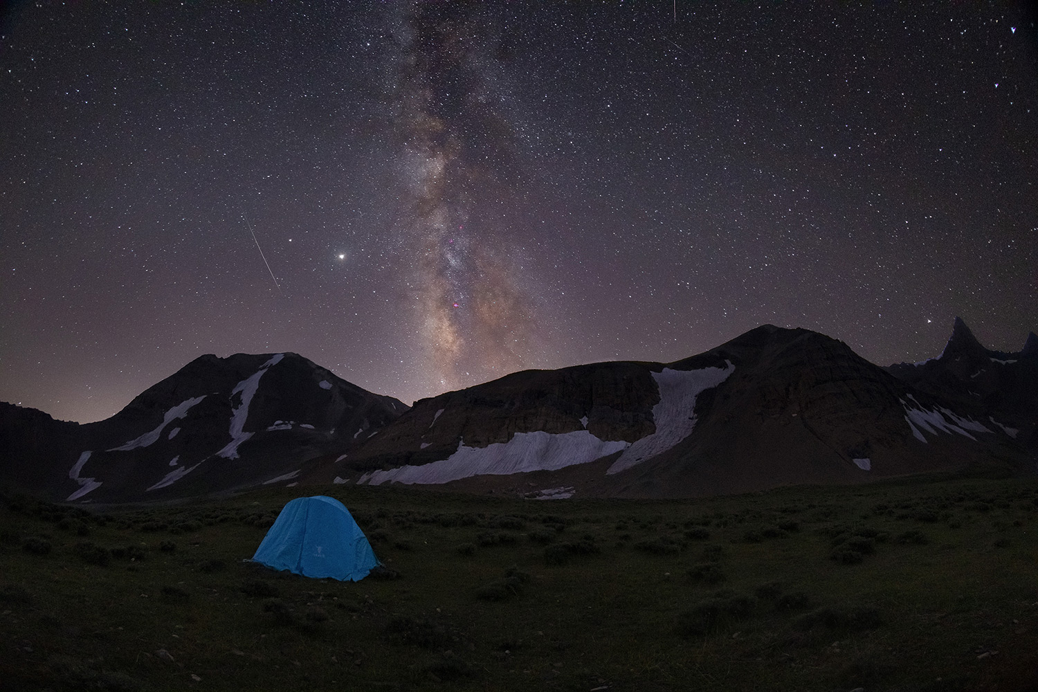 Single tent in the heart of the mountains