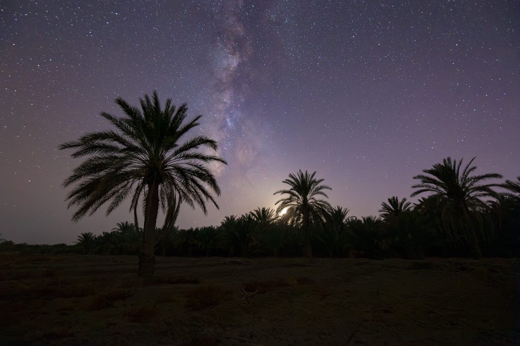 juxtaposition of the moon and the galaxy